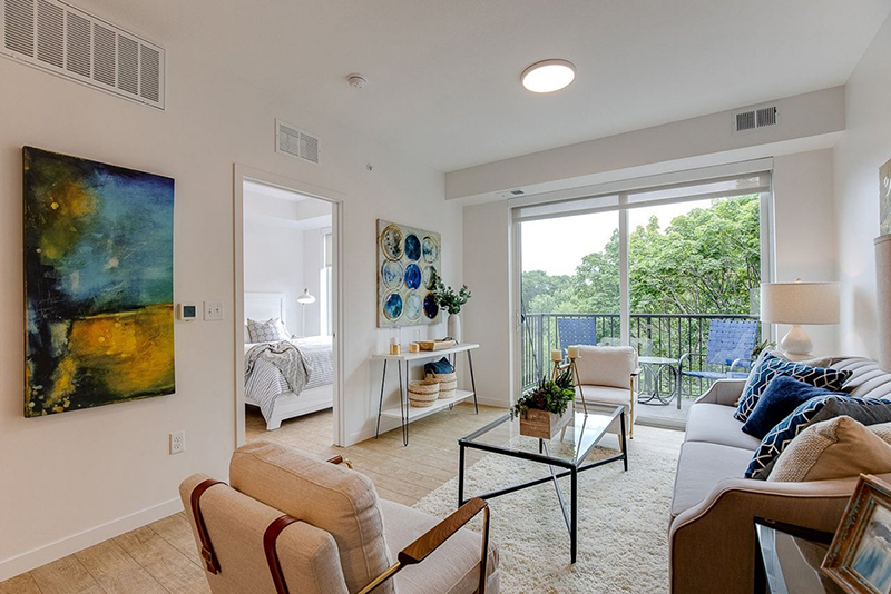the living room with a view of the bedroom