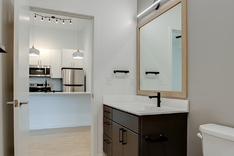 the bathroom with a view of the kitchen