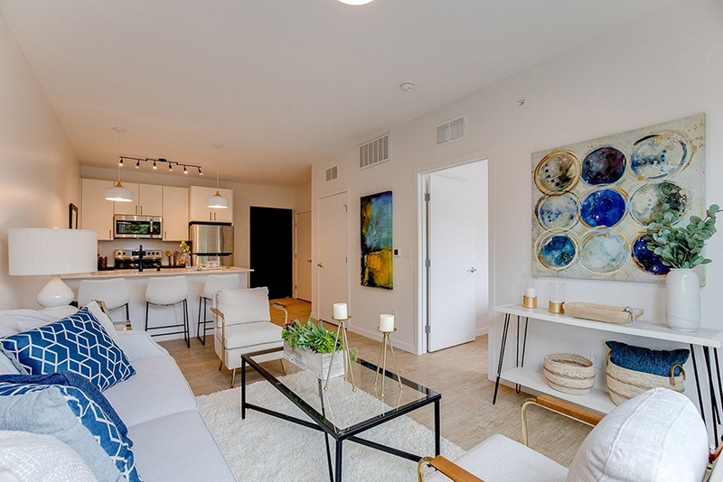the living room with a view of the kitchen